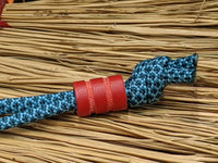 Medium Red G10 Lanyard Bead With Two Grooves and a Free Paracord Lanyard