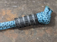 Medium Black Micarta Lanyard Bead With 4 Grooves and a Free Paracord Lanyard