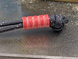 Medium Red G10 Lanyard Bead With Four Grooves and a Free Paracord Lanyard