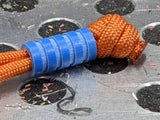 Medium Blue G10 Lanyard Bead With Four Grooves and a Free Paracord Lanyard